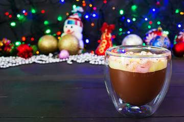 Cup of hot cocoa with marshmallows on Christmas background