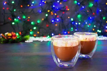Cup of hot cocoa with marshmallows on Christmas background