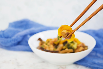 Stir fry chicken, broccoli and pepper on white background