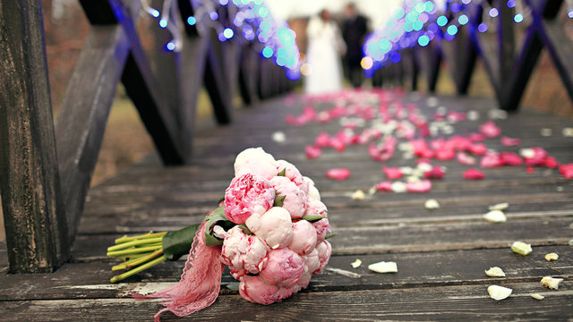 A Wedding Bouquet On The Wooden Floor