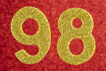Number ninety-eight gold color over a red background. Anniversary. Horizontal