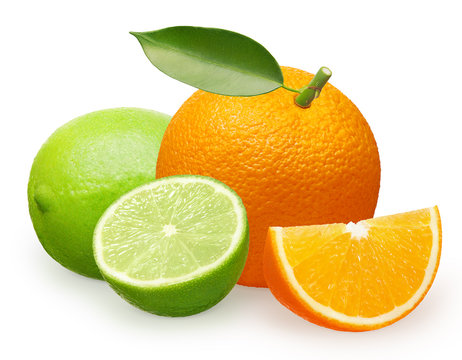 Orange fruit with green leaf, slice and lime with half