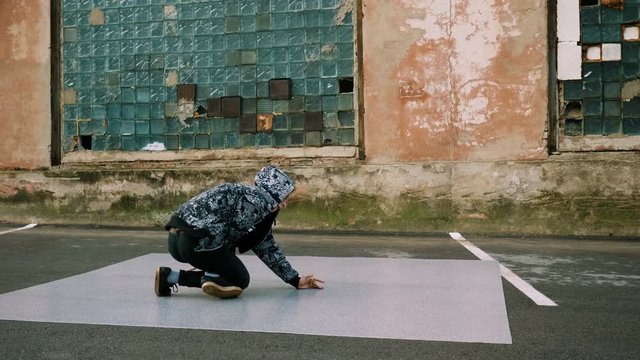 Breakdancer dancing on the street. 4K