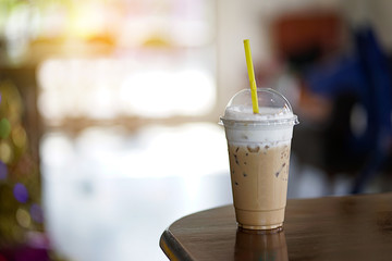 Iced coffee in coffee shop and  iced espresso  on old wooden table