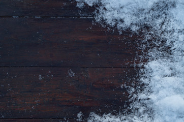 Old wood texture with snow flakes