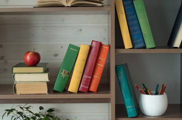 old books on wooden shelf.