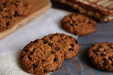 Chocolate cookies on wooden table. Chocolate chip cookies.