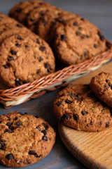 Chocolate cookies on wooden table. Chocolate chip cookies.