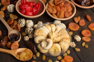 Dried fruits on wooden background