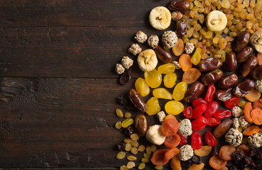 Dried fruits on wooden background