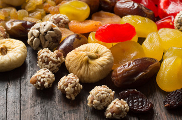 Dried fruits on wooden background