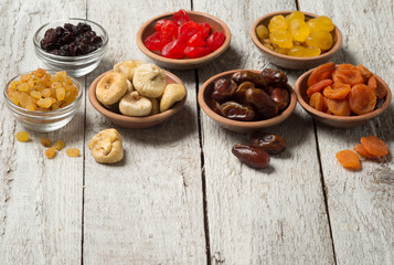 Dried fruits on wooden background