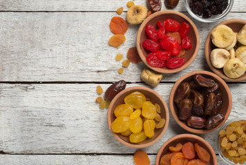 Dried fruits on wooden background