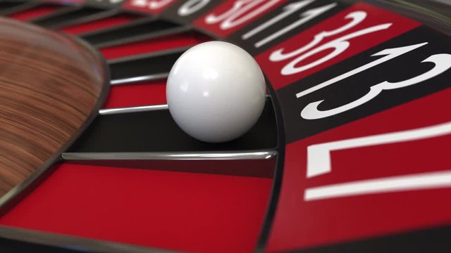 Casino roulette wheel ball hits 13 thirteen black