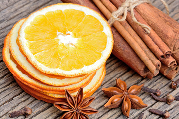 Sliced of dried orange with anise star clove and cinnamon sticks