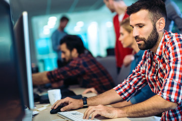 Portait of software designer working in office