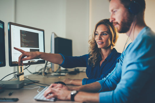 Software engineers working on project and programming in company