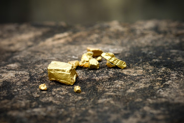 The pure gold ore found in the mine on a stone floor