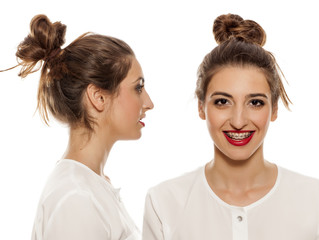 front, and side vide of young woman with loose bun on white background