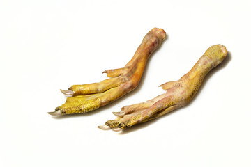 raw duck feet on white background