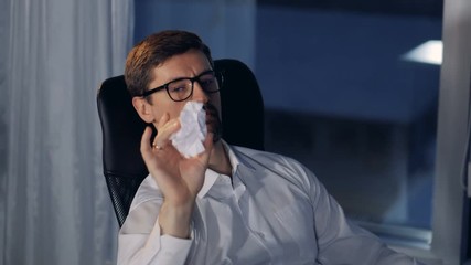 A view on a businessmans face as he throws paper balls. - Powered by Adobe