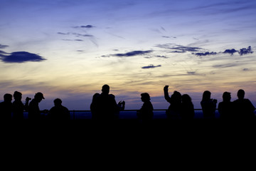 Fototapeta na wymiar Silhouette of many people watching sun rise