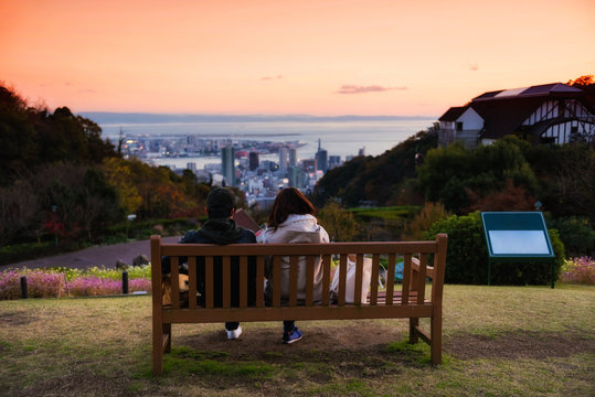 Couple see Kobe skyline at dusk