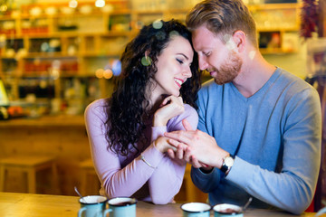 Romantic couple having date in coffee shop