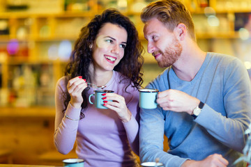 Romantic couple having date in coffee shop