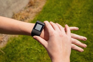 Woman using smartwatch in the gym