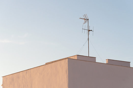 antenna on a roof at dawn