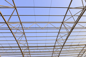 Fototapeta premium Steel structure workshop roof is under construction