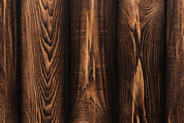 Texture of boards of dark old brown wood