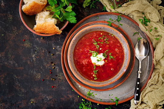 Traditional Ukrainian Russian borscht with beef on the bowl. Top view