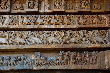 Reliefs on the outer wall of the Hoysaleswara Temple, Hoysala style, Halebidu, Karnataka.