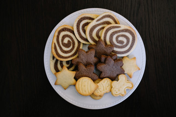 Christmas gingerbread cookies on a white plate.