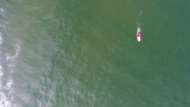 Aerial Top View Of Surfing Man In Hainan, China