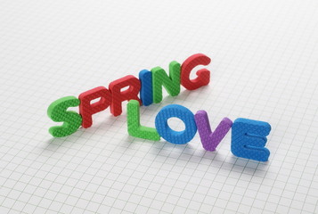 Naklejka premium Alphabet letters spelling out spring love isolated on white checkered background