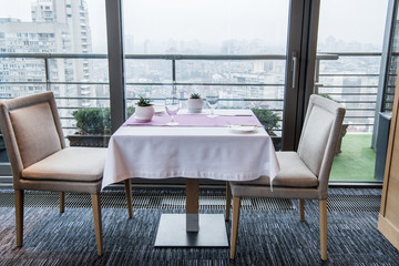 close up view of served table and chairs in restaurant