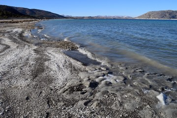 White sand on the shore of the lake. Lake Salda in Turkey. 