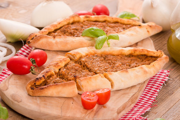 Turkish pide pizza with meat and onion. 