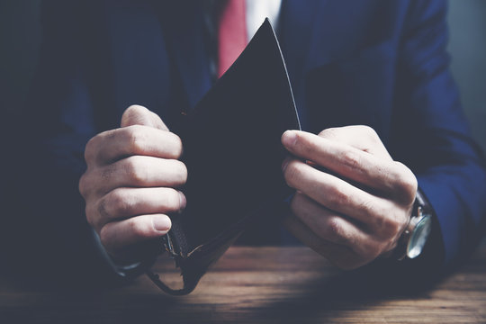 Business Person holding an empty wallet