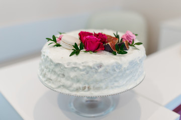 Beautiful white cake with flowers.