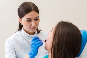 Beautiful girl on consultation at the dentist.