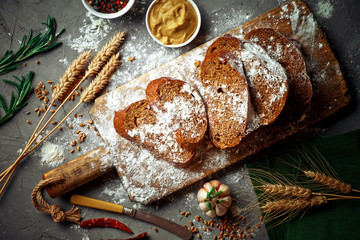 Bread and pastries in a composition with kitchen accessories on an old background