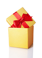 Golden classic shiny gift box with red satin bow