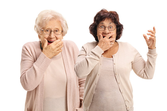 Two elderly women gesturing surprise