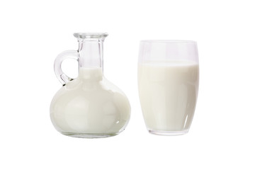 Milk jug with glass over white background.