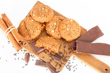 Chocolate cookies on wooden table. Chocolate chip cookies shot, top view White background.
