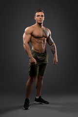 Fototapeta na wymiar Fitness male model shirtless full-length portrait